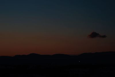 Scenic view of silhouette landscape against romantic sky at sunset