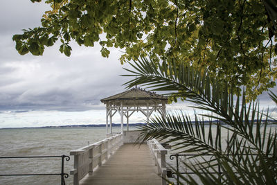 Pier over sea against sky