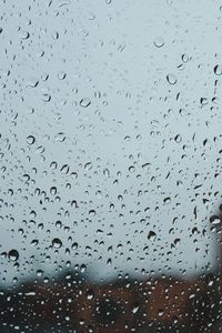 Full frame shot of raindrops on window