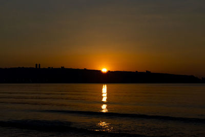 Scenic view of sea against sky during sunset