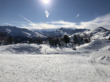 Scenic view of snowcapped mountains against sky