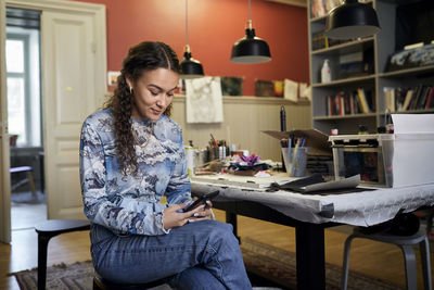 Young woman using cell phone