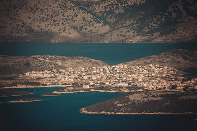 Aerial view of sea and mountain against sky