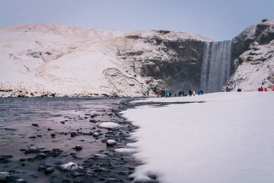 Scenic view of frozen lake against clear sky