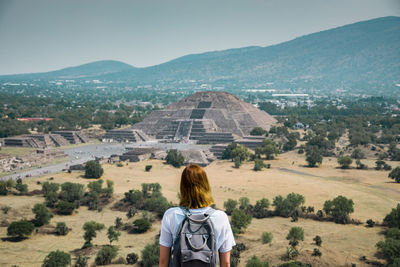 Rear view of woman looking at landscape