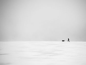 Scenic view of snow against clear sky