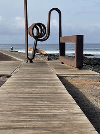 Pier over sea against sky