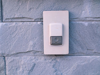 Close-up of electric lamp on wall