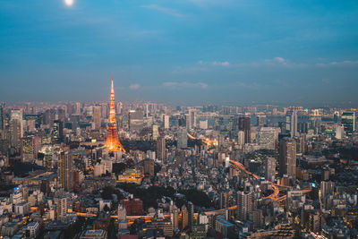 Aerial view of illuminated buildings in city