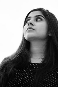 Portrait of a beautiful young woman over white background