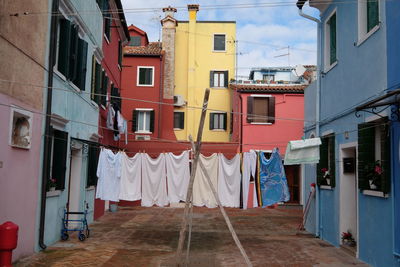 Clothes drying outside house