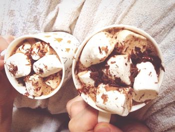 Close-up of hand holding ice cream