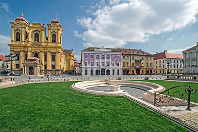 View of buildings against cloudy sky