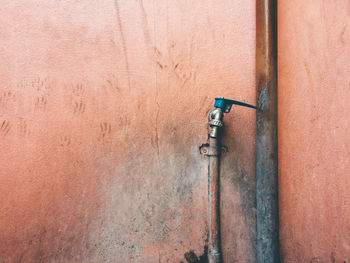 Close-up of pipe against wall