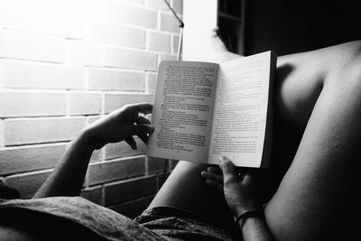 Close-up of hand holding book