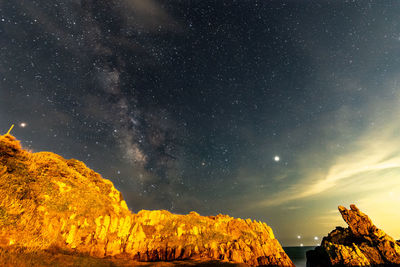 Scenic view of star field against sky at night