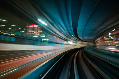 Light trails on illuminated city at night