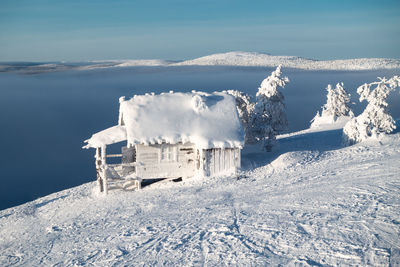 Snow on snowcapped mountain against sky