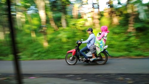 Man riding bicycle on road