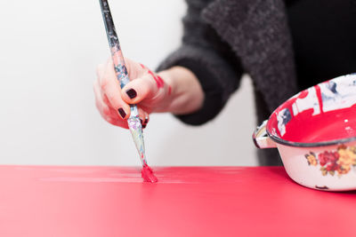 Close-up of woman using paintbrush