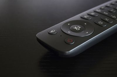 Close-up of remote control on table