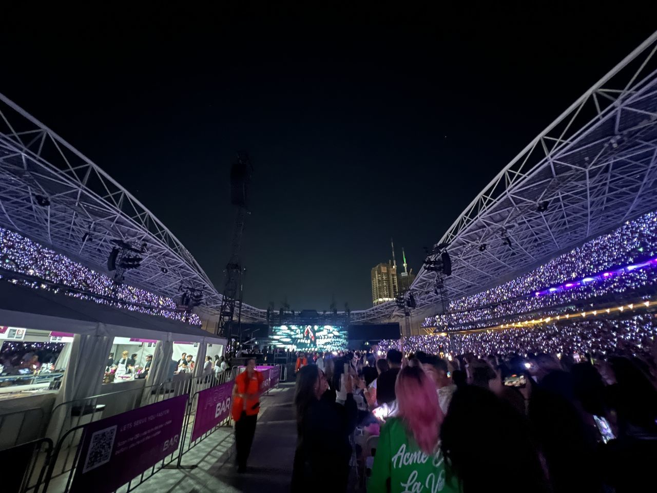 night, group of people, architecture, crowd, stadium, built structure, illuminated, large group of people, city, arts culture and entertainment, person, event, travel destinations, building exterior, adult, sport venue, travel, arena