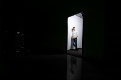 Man standing by window in building