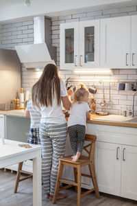 Women standing at home