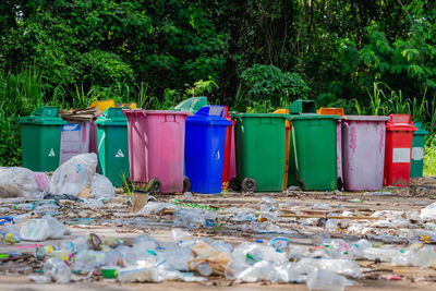 Plastic bins were left in the garbage collection area. pollute