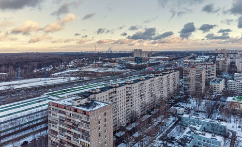 High angle view of buildings against sky during sunset
