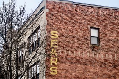 Low angle view of text on building wall