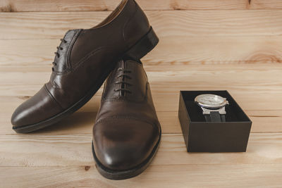 High angle view of shoes on hardwood floor