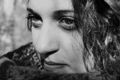 Close-up portrait of young woman looking away