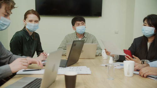 Group of people working on table