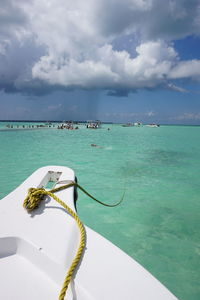 Sailboat in sea against sky