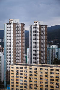 Modern buildings against sky in city