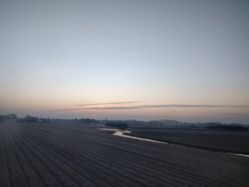 Scenic view of landscape against sky during sunset