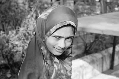 Portrait of a smiling young woman in winter