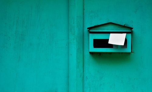 Close-up of mailbox on wall