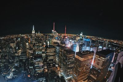 Illuminated buildings in city at night