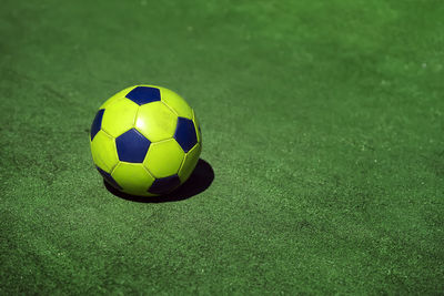 High angle view of soccer ball on grass