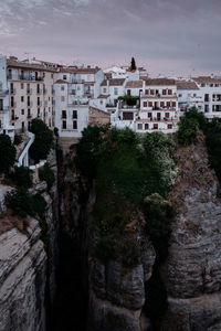 High angle view of buildings and trees against sky