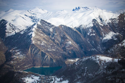 Scenic view of snowcapped mountains against sky