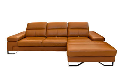 Close-up of sectional sofa against white background