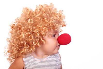 Close-up of baby against white background