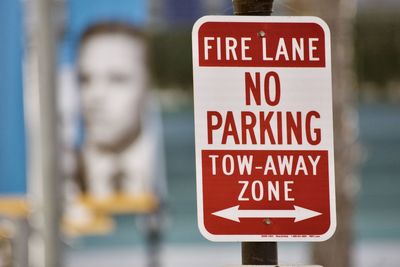 Close-up of warning sign on road