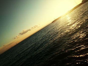 Scenic view of beach against sky during sunset