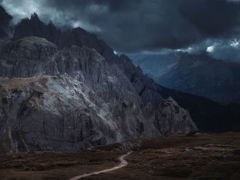 Dolomites rocky mountains and footpah, italy