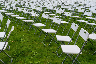 Empty chairs on field