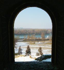 Scenic view of sea against clear sky seen through window